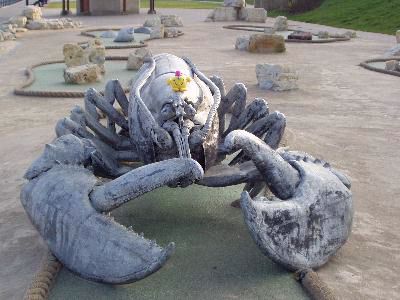 Sat on giant metal lobster sculpture