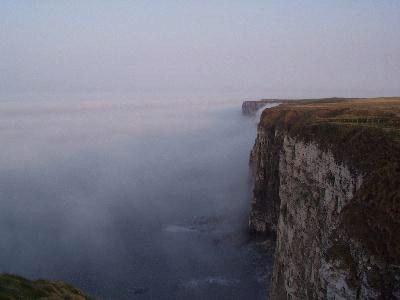 Steep Cliffs climbing out of mists